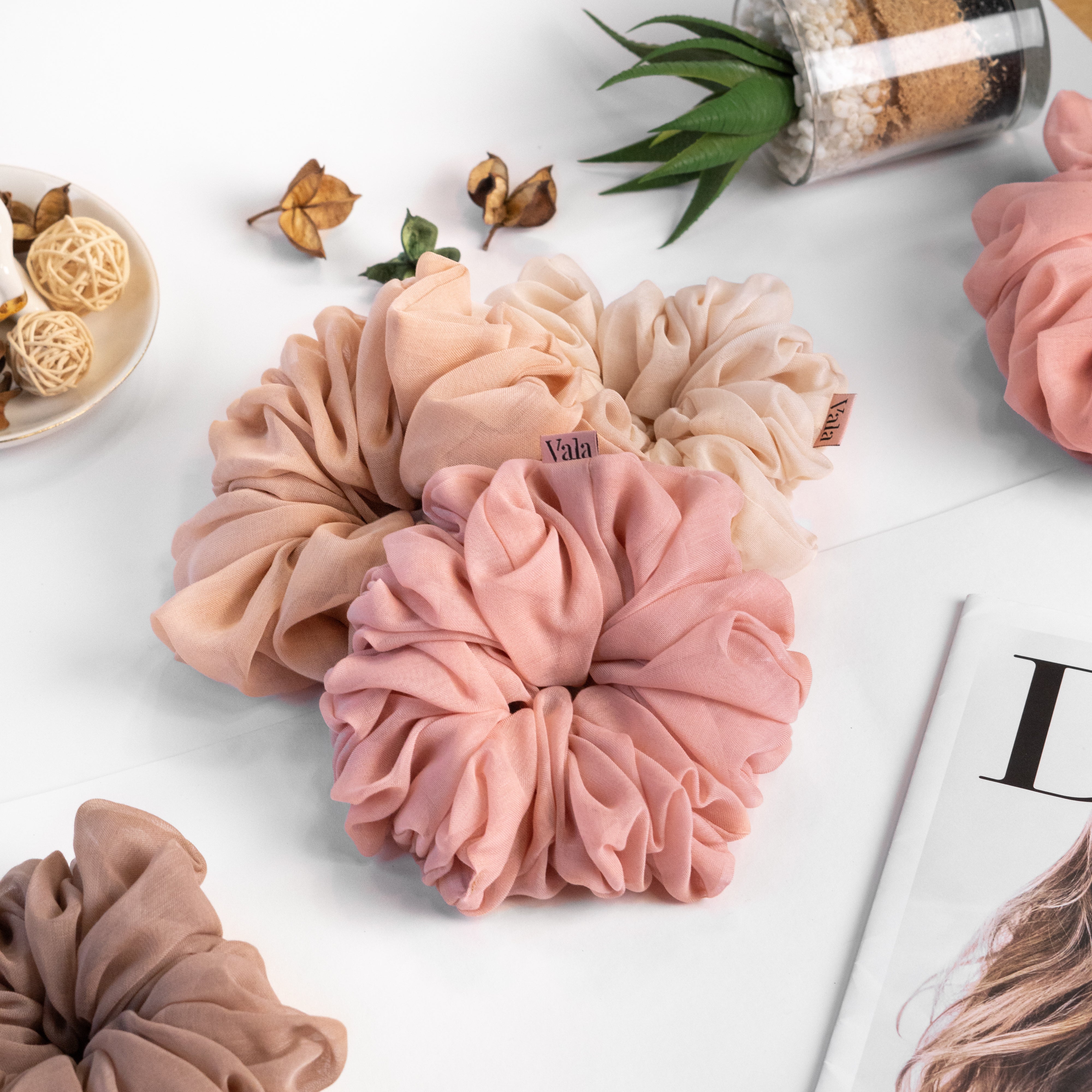 Vala handmade scrunchies in the colour pink, beige, rose and larch